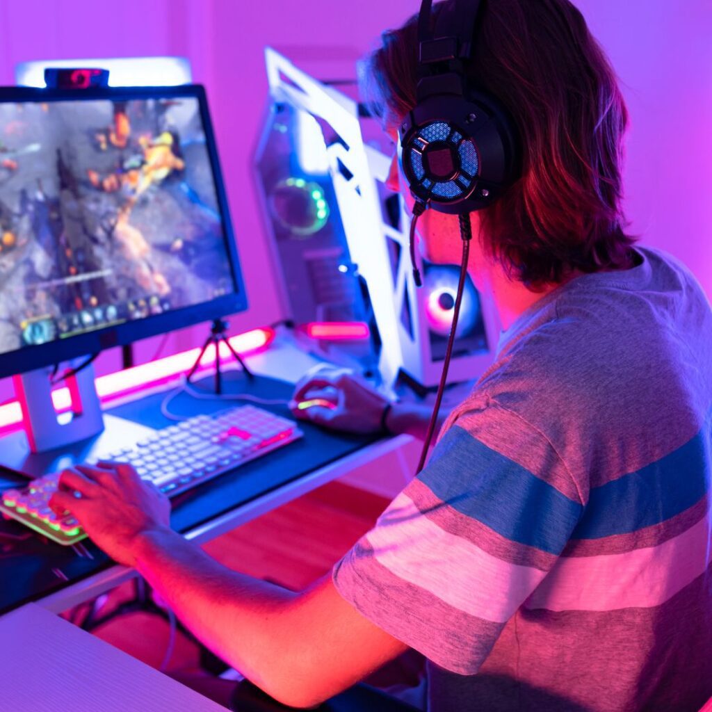 a boy playing online games to earn money online